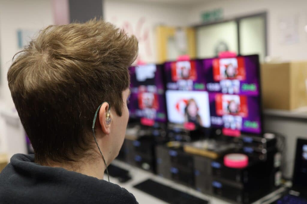 On Event Production Company | Live, Hybrid and Virtual Event Production | Technician with earpiece