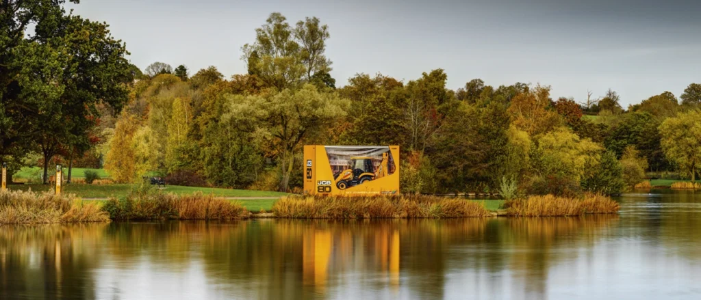 On Event Production Company | Live, Hybrid and Virtual Event Production | JCB Outdoor Exhibition Build from lake